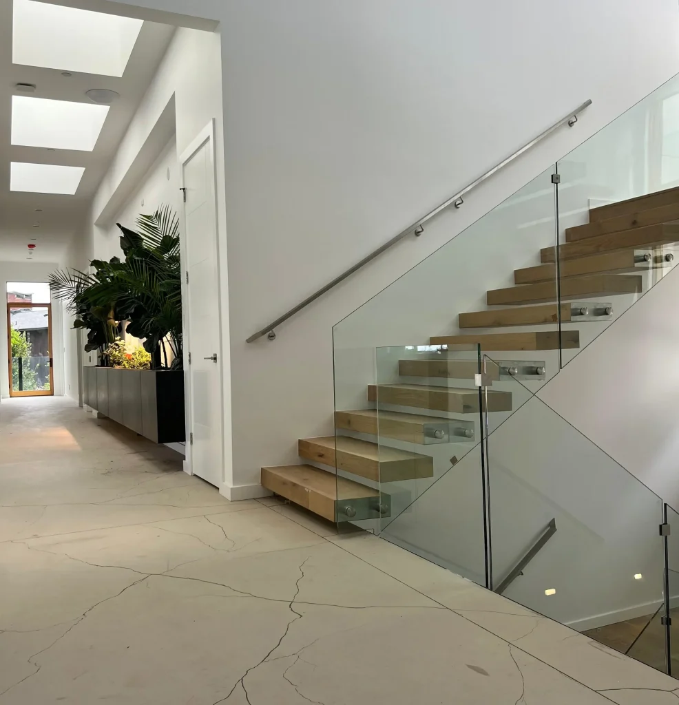 Cantilever Floating Stairs with Frameless Glass Railings in a Modern Seattle Home
